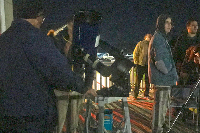 TAS visitors and volunteers enjoying telescope viewing